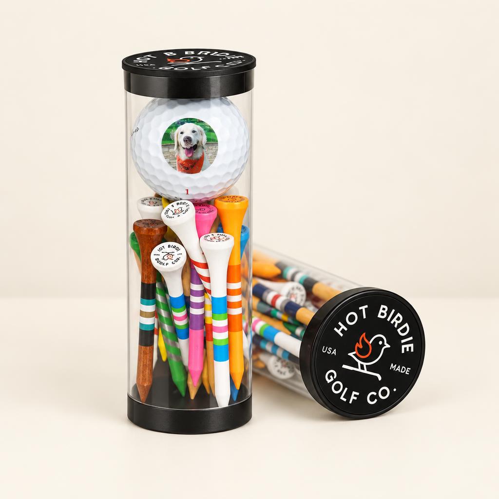 Clear tube with one custom golf ball and fifteen colorful tees